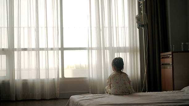 istock Young Asian girl is sick in bed 2210663177