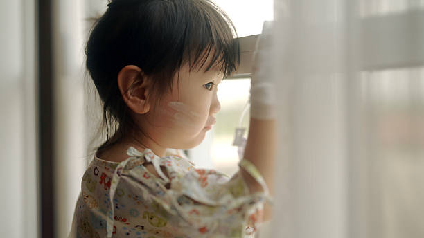 istock Young Asian girl is sick in bed 2210663180
