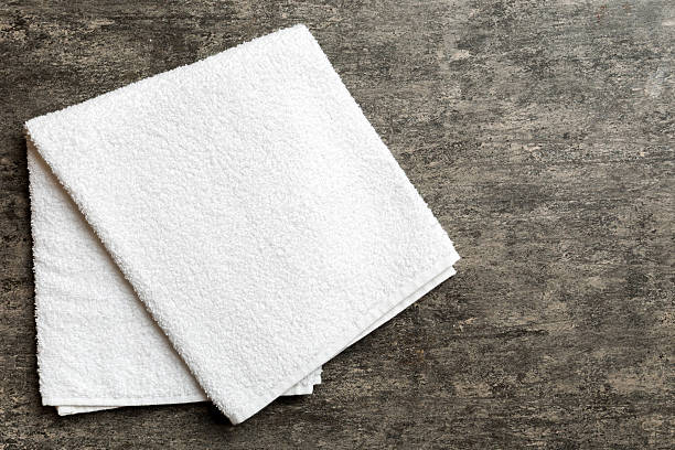 istock Top view of white towels with copy space on colored background 2210665312