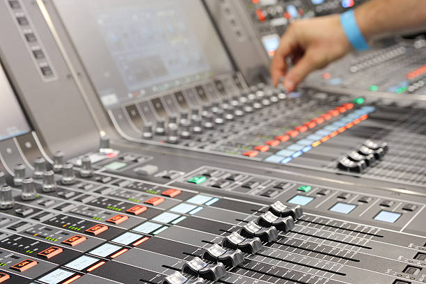 istock Sound engineer hands adjusting control sound mixer in recording, broadcasting studio 2210666302
