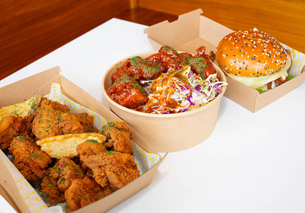 istock Korean deep-fried chicken on white rice with hot spicy sauce 2210667766