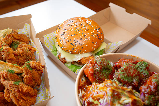 istock Korean deep-fried chicken on white rice with hot spicy sauce 2210667883