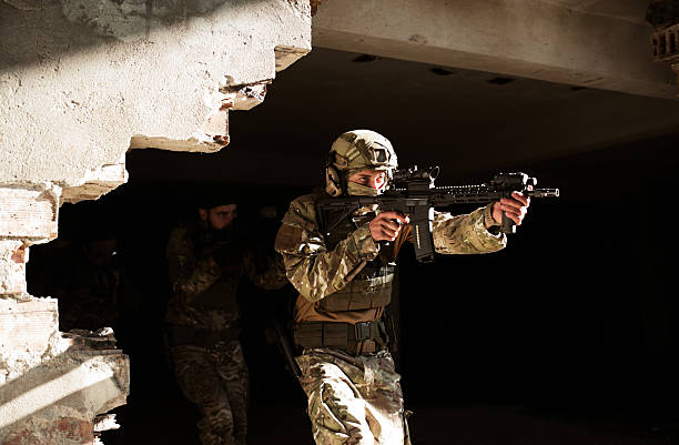istock Army troops advance a position in combat. 2210668125