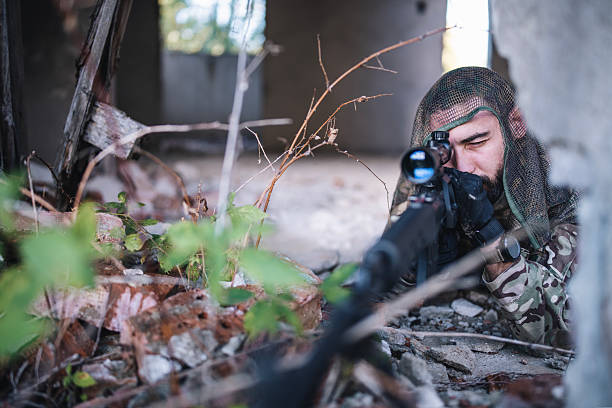 istock Sniper aiming for enemies in war. 2210668131