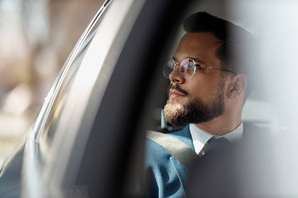 istock Businessman Looking Through Car Window 2210668209
