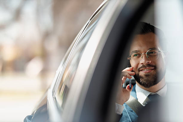 istock Businessman Talking on Phone Inside Car 2210668210