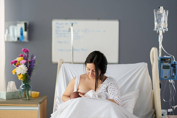 istock Nursing Newborn in the Hospital 2210668259