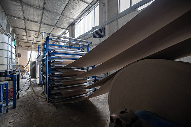 istock A production line at a solid cardboard or Binding cardboard manufacturing facility shows rolls being processed. The facility uses recycled materials (waste paper) to create cover board stock for books. 2210668300