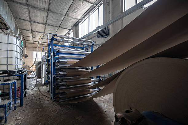 istock A production line at a solid cardboard or Binding cardboard manufacturing facility shows rolls being processed. The facility uses recycled materials (waste paper) to create cover board stock for books. 2210668307
