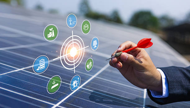 istock Businessman Targeting Renewable Energy Solutions on Solar Panels 2210668780