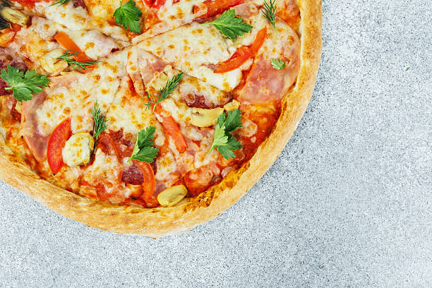 Mouthwatering pizza featuring a variety of toppings like cheese, peppers, and herbs.