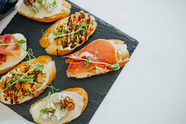 istock Delicious appetizers served on a slate platter with fresh ingredients 2210669165
