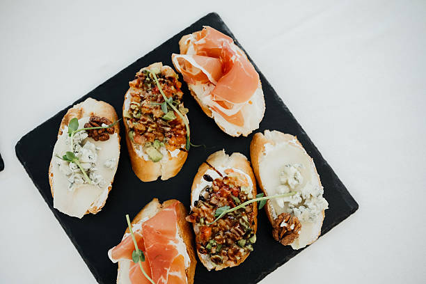 istock Gourmet appetizers on a serving platter at a social gathering 2210669270