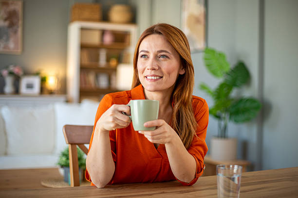 istock Woman enjoying coffee at home 2210671690