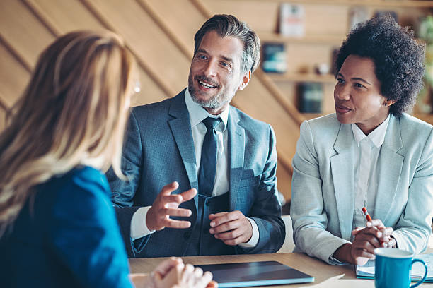 istock Middle age businessman talking on a meeting 2210677759