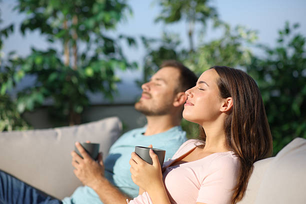 istock Couple relaxing and drinking in a terrace 2210679188