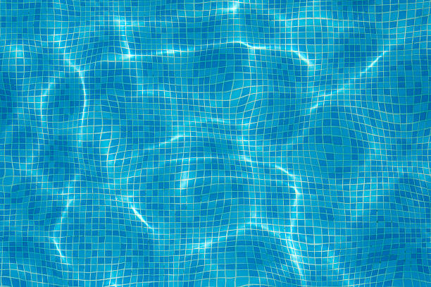 Blue water of the pool. Background. Selective focus.
