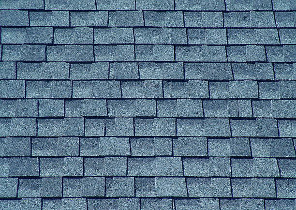 istock Modern asphalt shingles covering a roof creating a textured pattern 2210681868