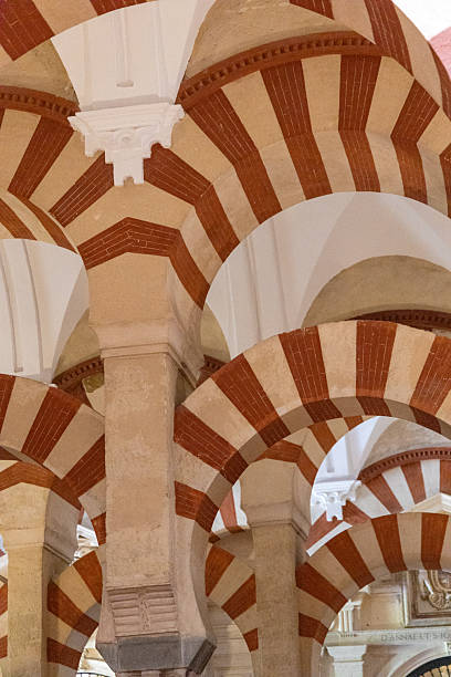 The Arabic arches of the Mezquita in Cordoba, Spain. No people. Part of a series.