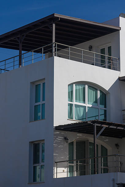 istock Coastal retreat captures modern architecture under a vivid blue sky showcasing elegant design elements in a serene setting 2210688489