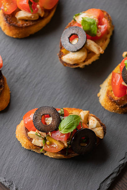 istock delicious Italian party appetizer featuring caprese crostini 2210689824