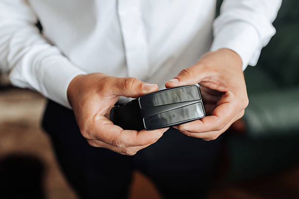 istock A man is holding a wallet in his hand 2210689923