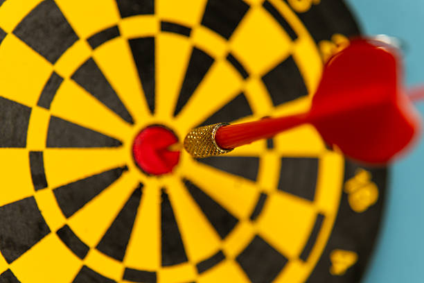 istock Dart hitting the bullseye on a colorful dartboard in a casual game environment 2210690908