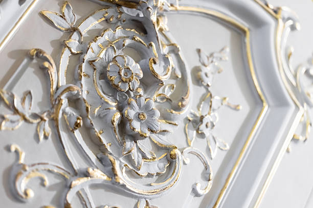 istock Ornate baroque-style floral wall decoration accentuated with gold paint 2210692202