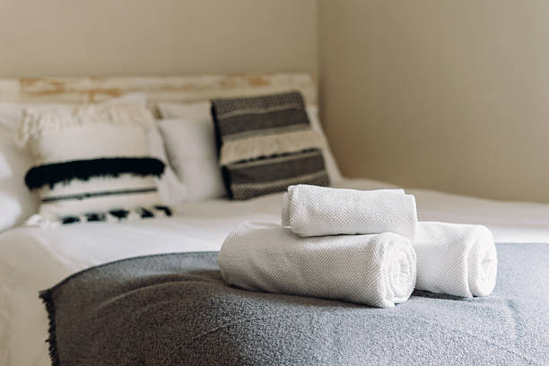 istock Cozy and modern bedroom featuring neatly arranged towels and stylish decor 2210692319