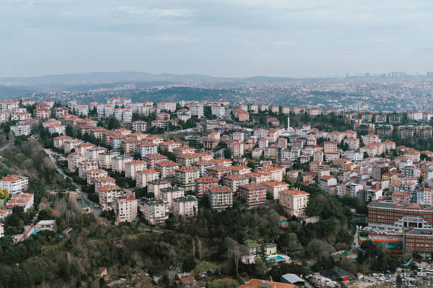 A panoramic view of Istanbul’s evolving architecture, showcasing the contrast between traditional low-rise buildings and modern skyscrapers under a snowy sky. The urban transformation reflects the city’s dynamic growth and architectural diversity