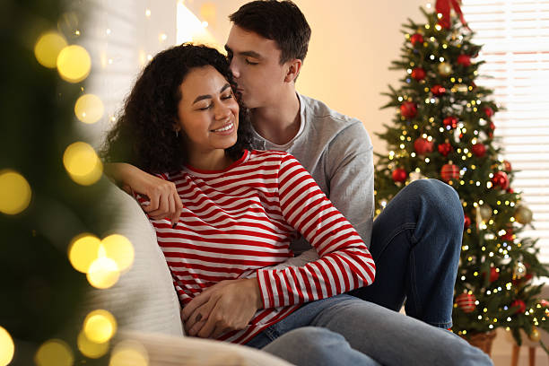 istock Happy couple spending time together at home. Christmas celebration 2210694207