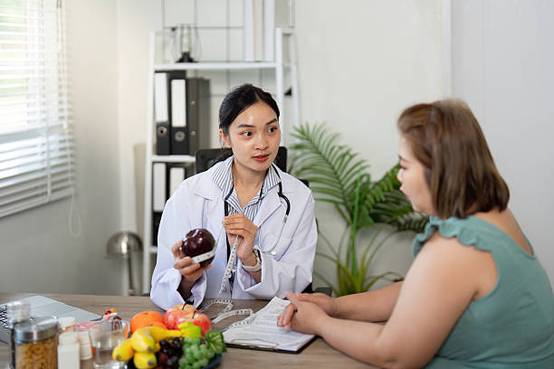 istock Dietary Counseling and Nutrition Guidance. A nutritionist explaining healthy eating principles while consulting with a client in a friendly atmosphere. 2210694465
