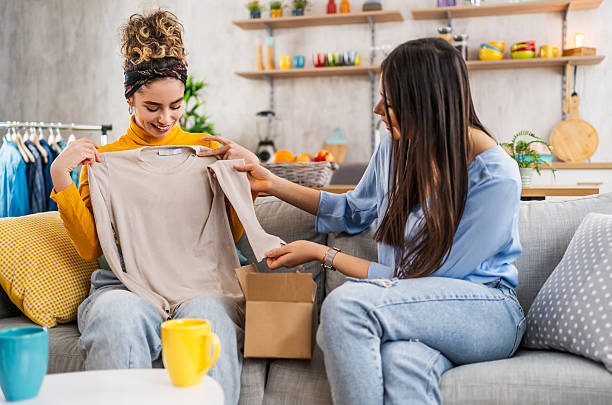 istock Two young women unpacking clothes at home 2210698705