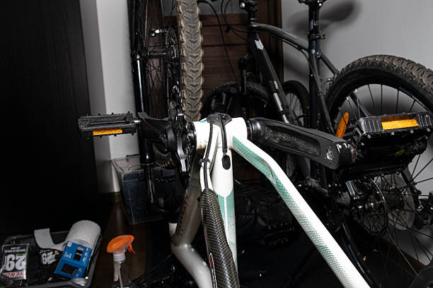 istock Home bicycle repair. A man assembles a bicycle at home. Do-it-yourself bicycle repair. 2210699676