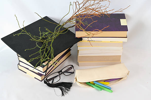 istock A stack of books is next to a pencil case and a pair of glasses 2210702902