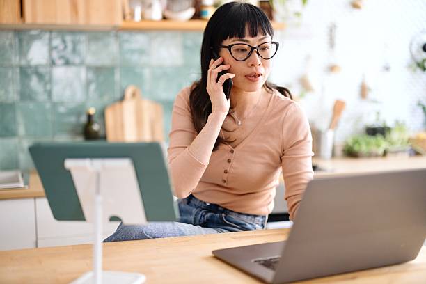 istock Woman talking with someone while investing 2210706191