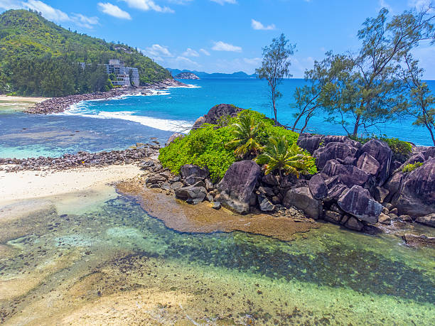 istock Rocks and blue sea in a tropical lagoon 2210709198