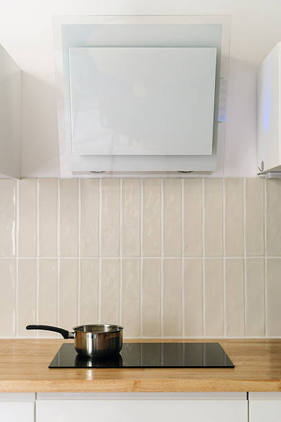 istock Modern kitchen design featuring sleek surfaces and a stainless steel pot on the stove 2210710454