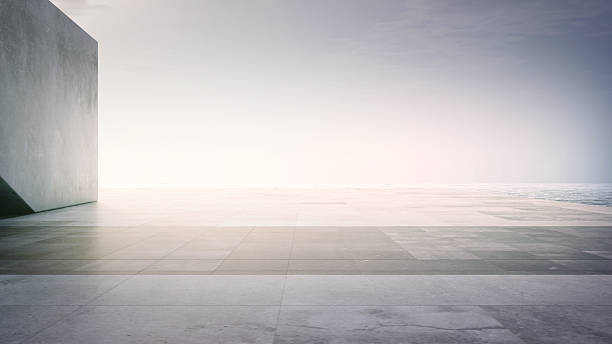Empty concrete floor terrace near water.