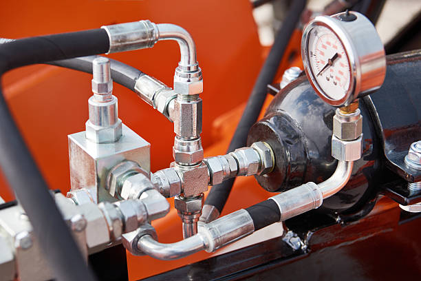 istock Manometer and hoses of hydraulic machine 2210710901