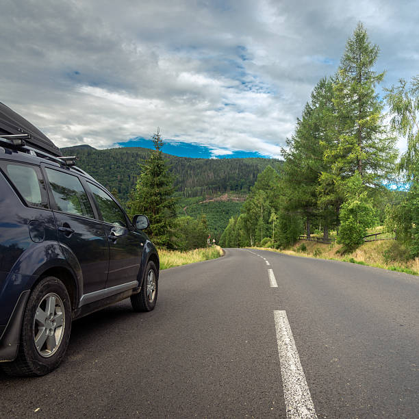 istock car for traveling with a mountain road 2210712805