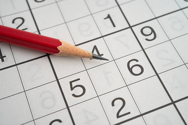 istock Sudoku puzzle game playing to challenge brain. 2210713656