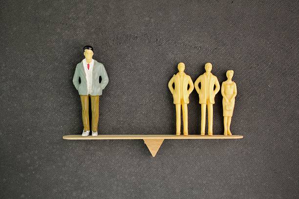 istock balance between the leader and three people. dynamic relationship between leadership and teamwork. authority and empathy, promoting accountability, shared responsibility, and effective communication 2210715769