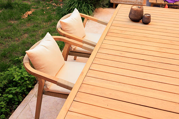 istock Outdoor wooden dining table with cozy chairs 2210716300