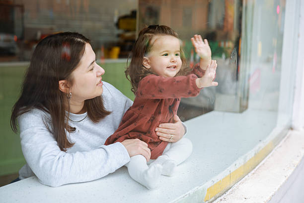 istock Smiling young mother and baby daughter 2210716475