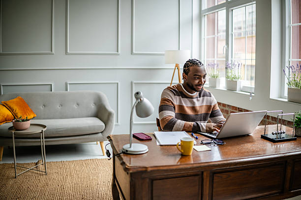 istock Young man engaged in online learning from a comfortable home office during a daytime session 2210717093