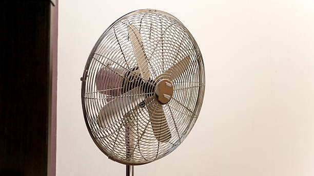 istock Household home fan on white wall background in room 2210719559