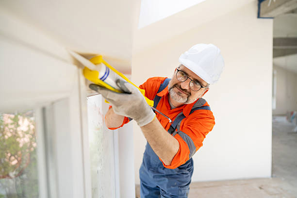 istock A craftsman is applying silicone around the window edges during renovation work 2210719818