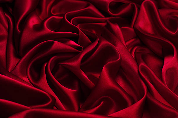 istock Rich and luxury red silk fabric texture background. 2210720133