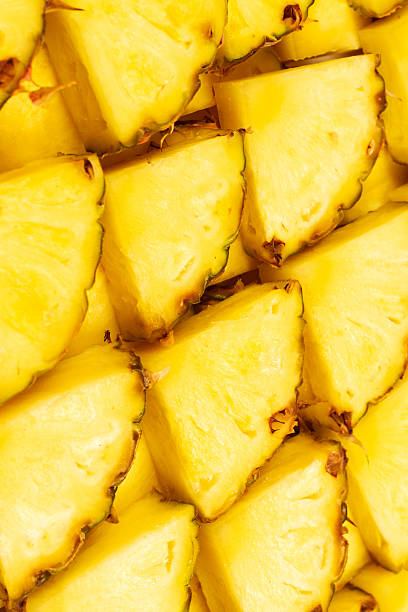 istock Pineapple juicy yellow slices background. Top view. 2210720181